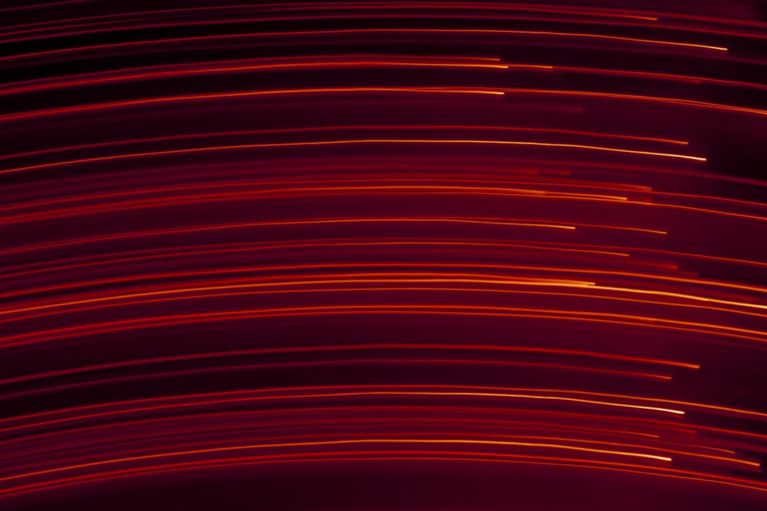 Abstract red and black digital light background — photo by Dollar Gill on Unsplash